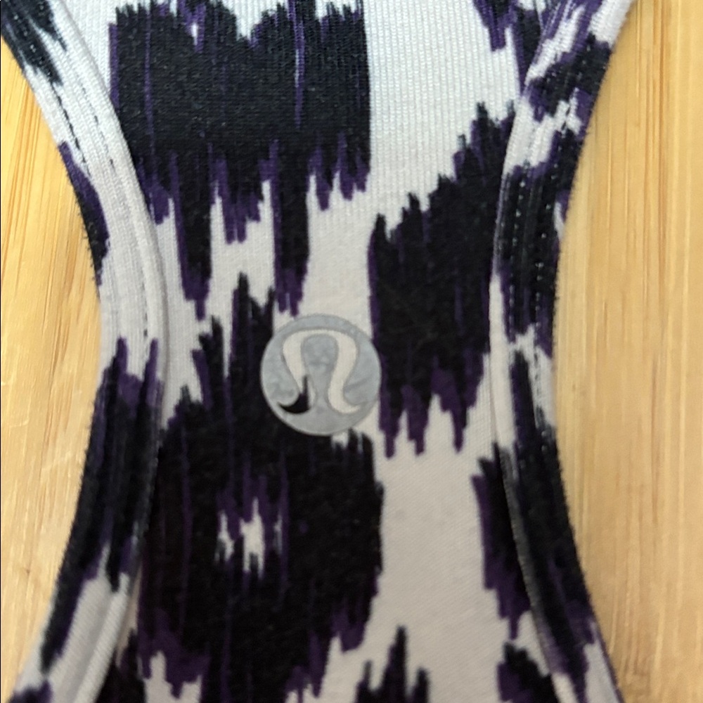 Lululemon tank top. No tag. Measures a size 4. White,black and purple. - Picture 3 of 7